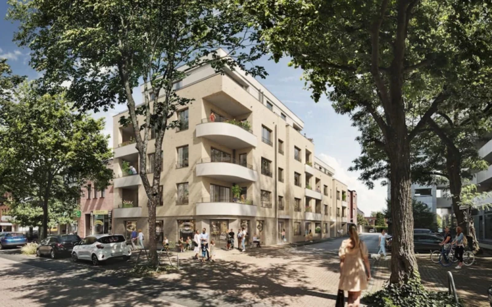 Neubau mit hellen Fassaden und markanten Balkonen zwischen Bäumen an einer Straßenecke